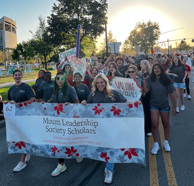 students and banner "Mount Leadership Society Scholars"